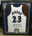 Picture of FRAMED MICHAEL JORDAN SIGNED JERSEY AND CARD