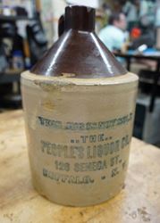 Picture of VINTAGE STONE WEAR VINTAGE  JUG. "THIS JUG IS NOT SOLD..THE.. THE PEOPLE'S LIQUOR CO. 126 SENECA ST BUFFALO.- N.Y COLLECTIBLE". GOOD CONDITION. 