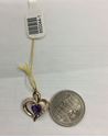 Picture of 14kt yellow gold heart pendant with 7 round diamonds and heart shape amethyst 2.2gr pre owned 850044-1