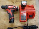 Picture of Milwaukee 2407-20 3/8" 12V Drill/Driver With 2 Batteries 48-11-2401 And Charger 48-59-1812. used. tested. in a good working order. very good condition.