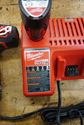 Picture of Milwaukee 2407-20 3/8" 12V Drill/Driver With 2 Batteries 48-11-2401 And Charger 48-59-1812. used. tested. in a good working order. very good condition.