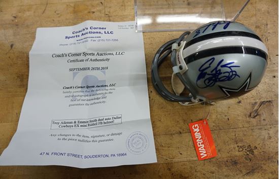 Picture of MINI HELMET SIGNED BY 3; TROY AIKMAN 8 ; EMMITT SMITH 22; 3RD SIGNATURE UNKNOWN DALLAS COWBOYS WITH COA. MINT CONDITION. COLLECTIBLE. RIDDELL MINI HELMET 