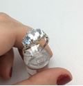 Picture of 14kt white gold ring size 7.25 with 4 small diamonds and 3 light blue oval stones 2.7 gr 803093-1 