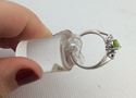 Picture of 10kt white gold ring size 7 2.1 gr with green peridot and 2 small diamonds mint 834090-4