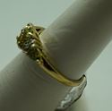 Picture of 10KT YELLOW GOLD RING WITH  4 DIAMONDS 0.02PTS AND 3 PERIDOTS  (1 OVAL; 2 PEAR SHAPE).1.8GR SIZE 7.25 VERY GOOD CONDITION. PRE OWNED.