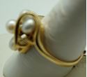 Picture of 14kt yellow gold ring size 9.5 with pearls and diamonds . 2 diamonds small. 4 pearls . Total weight 5.6gr. Pre owned. 838381-1.