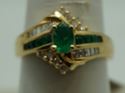 Picture of 14kt yellow gold ring with emeralds and diamonds size 8 5.2 gr total weight .approximately 0.25 carat of diamonds ( 8 round diamonds 10 baguette diamonds) and emeralds 8 e,early cut diamonds 1 oval . 845074-2.