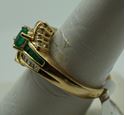 Picture of 14kt yellow gold ring with emeralds and diamonds size 8 5.2 gr total weight .approximately 0.25 carat of diamonds ( 8 round diamonds 10 baguette diamonds) and emeralds 8 e,early cut diamonds 1 oval . 845074-2.