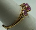 Picture of 10kt yellow gold ring with 3 pink hearts stones and 2 little diamonds. Total weight 1.6 gr . Size 7 . Pre owned. 846774-1. 