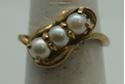 Picture of 10kt yellow gold fashion ring with pearls size 6 pre owned .3 pearls X 4.5 mm. Total weight 2.8 gr . 845765-1. 