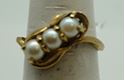 Picture of 10kt yellow gold fashion ring with pearls size 6 pre owned .3 pearls X 4.5 mm. Total weight 2.8 gr . 845765-1. 