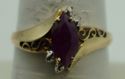 Picture of 10kt yellow gold ring with red margie stone size 8.25 2.0gr very good condition . pre owned. 852046-1. 