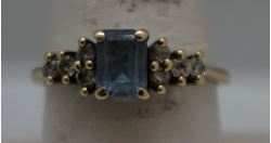 Picture of 10KT YELLOW GOLD RING WITH BLUE STONE AND  8 CZS SIZE 8.5 2.4 GRAMS  VERY GOOD CONDITION. 849283-1. 