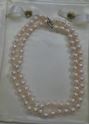 Picture of 26 INCH LONG  PEARL PEACH COLOR (7MM)  NECKLACE WITH 14KT WHITE GOLD CLASP VERY GOOD CONDITION. WITH CASE.
