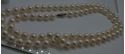 Picture of 26 INCH LONG  PEARL PEACH COLOR (7MM)  NECKLACE WITH 14KT WHITE GOLD CLASP VERY GOOD CONDITION. WITH CASE.