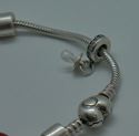 Picture of PANDORA STERLING SILVER BRACELET WITH 12 CHARMS 49.9 GRAMS PRE OWNED 851137-1 