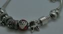 Picture of PANDORA STERLING SILVER BRACELET WITH 12 CHARMS 49.9 GRAMS PRE OWNED 851137-1 