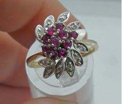 Picture of 14KT YELLOW  GOLD CLUSTER RING SIZE 7 5 GRAMS WITH 10 ROUND DIAMONDS 0.10PTS; RED STONES.  PRE OWNED. VERY GOOD CONDITION. 853791-1.