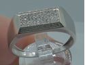Picture of 10kt white gold men's ring with 0.25 carat of diamonds; 3.8 grams; size 11.5. pre owned. very good condition. 831278-2. 