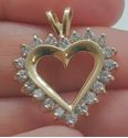 Picture of 14kt yellow gold heart pendant with round diamonds ( 1 carat ) 3.6 grams . pre owned. very good condition. 775406-5.