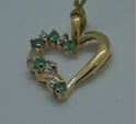 Picture of 10kt yellow gold heart pendant with 2 small diamonds and 5 emeralds 1.5 grams 817670-1