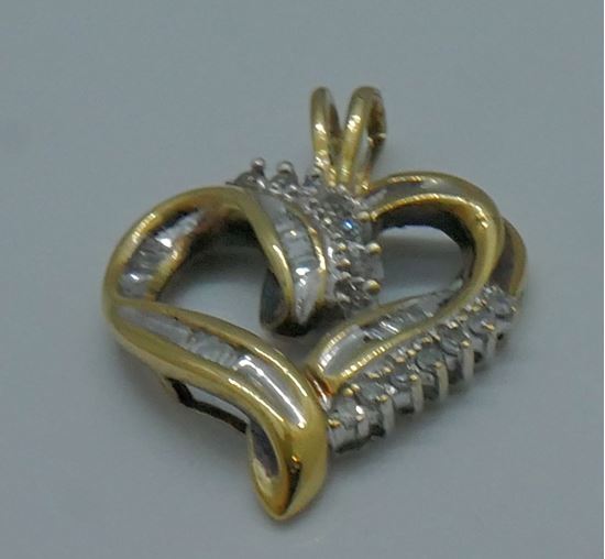 Picture of 10kt yellow gold 2.6 grams diamond heart pendant 14 round .16 baguette diamonds 0.25 ctw 806514-1