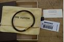 Picture of Louis Vuitton cowhide leather bracelet M6609D pre owned with case and dust bag.  pre owned. very good condition. 